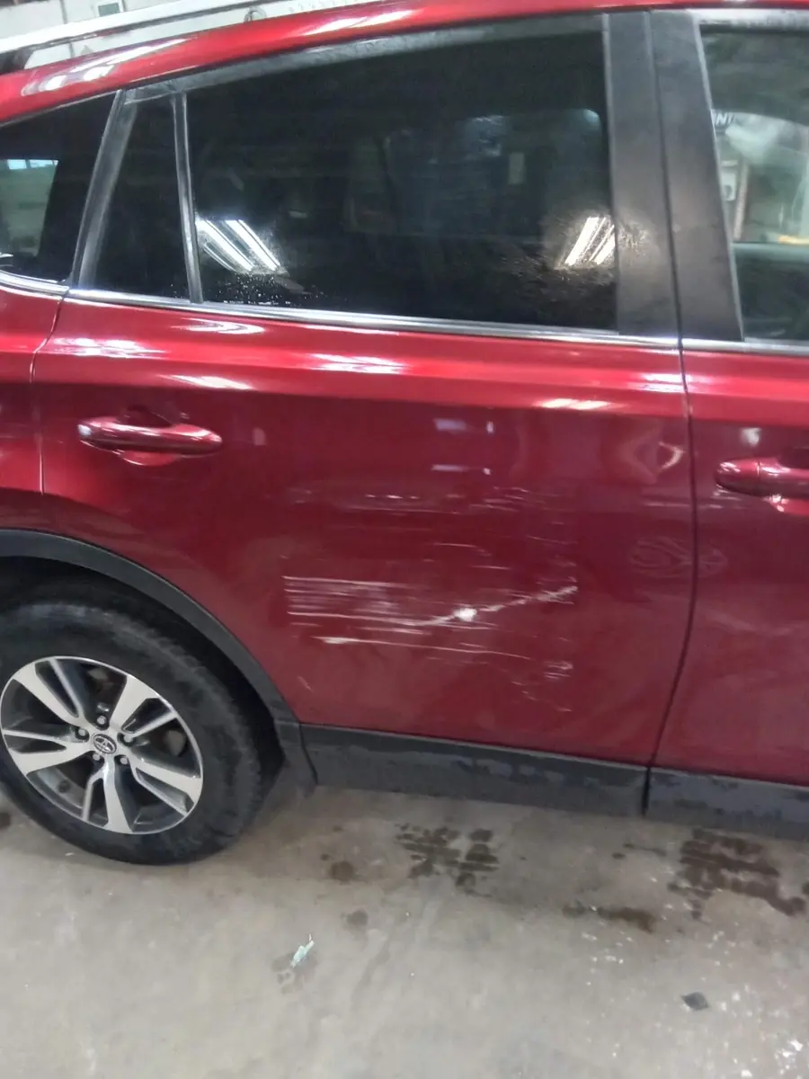 Scrapes across a red rear door