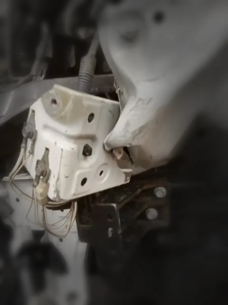 Close-up of damaged front structure and brackets