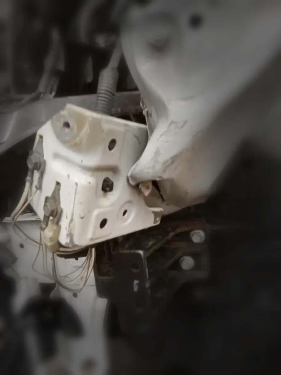 Close-up of damaged front structure and brackets